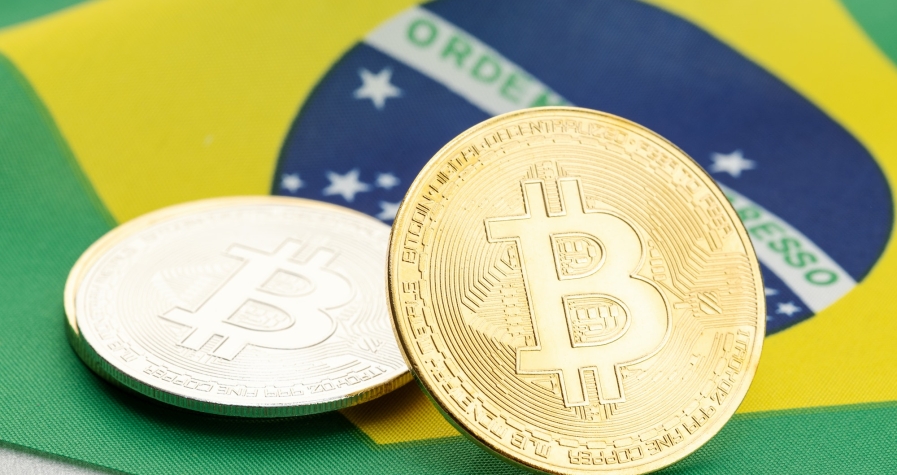 Bitcoin cryptocurrency coins on national flag of Brazil