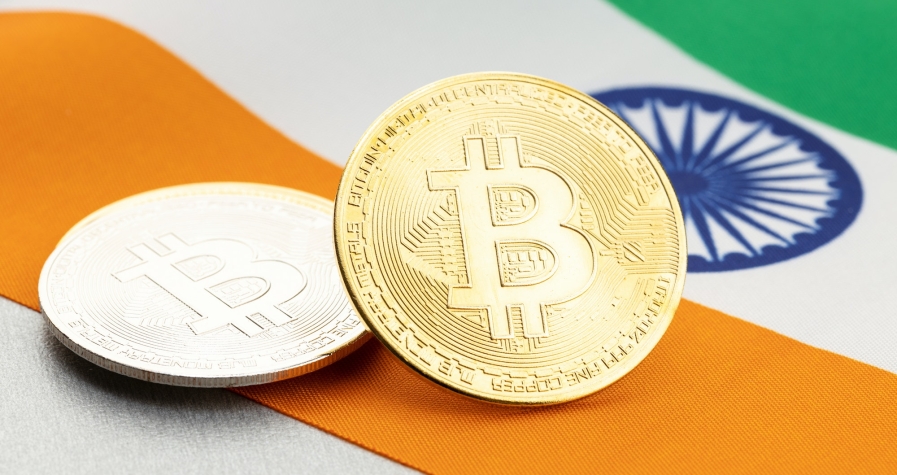 Bitcoin cryptocurrency coins on national flag of India