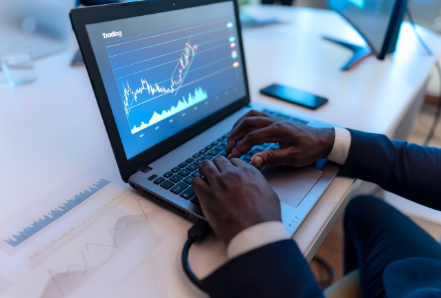 Close up of business trader man working on crypto currency markets with blockchain technology