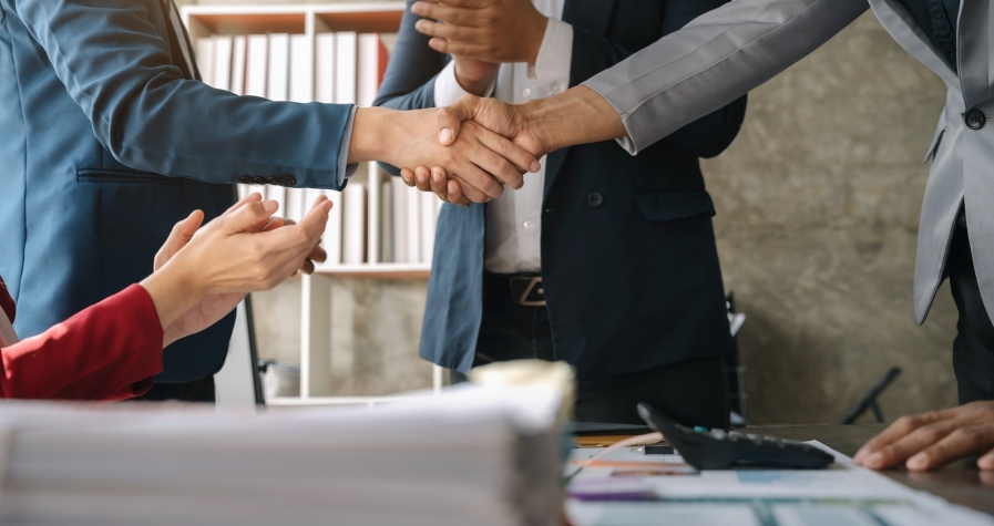 Close up two men shake hands at business meeting, office negotiations, Successful negotiations.