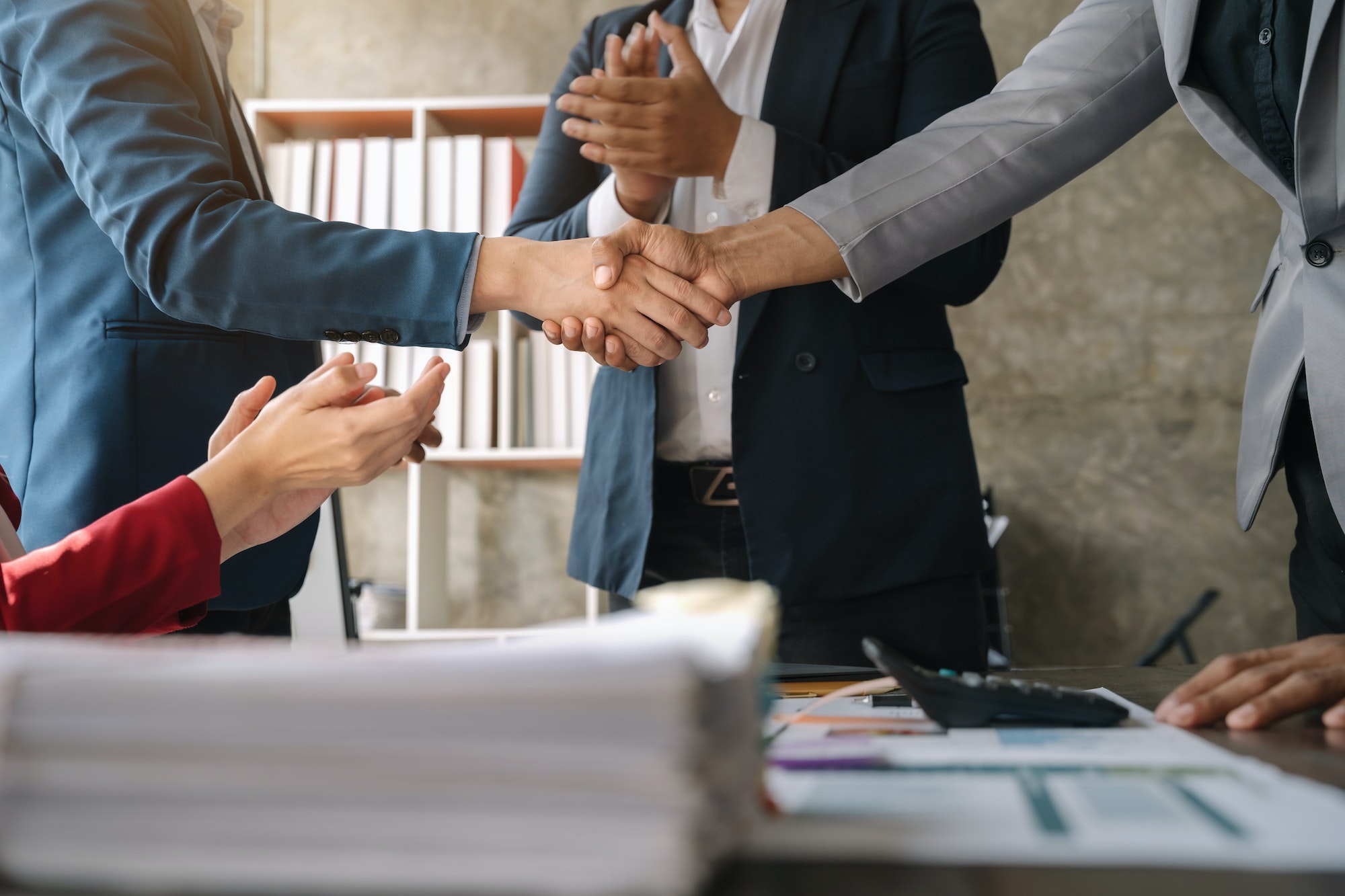 Close up two men shake hands at business meeting, office negotiations, Successful negotiations.